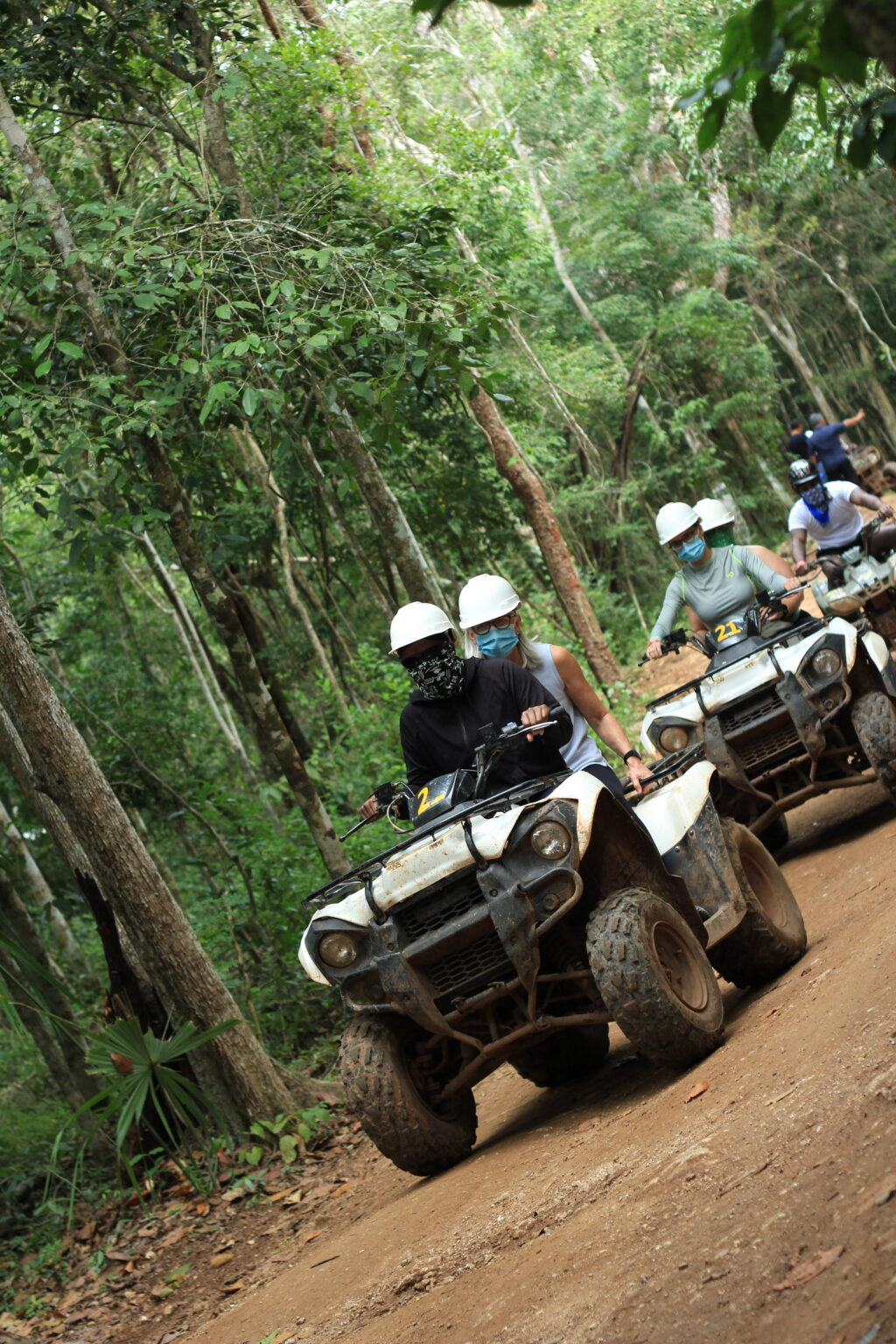 ATVs driving along a jungle trail near Cancun