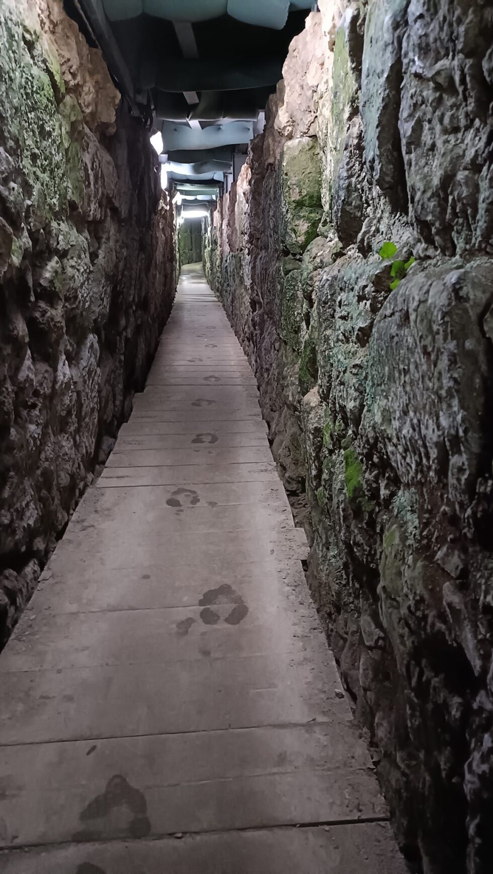 Narrow ancient passage through stone in the City of David