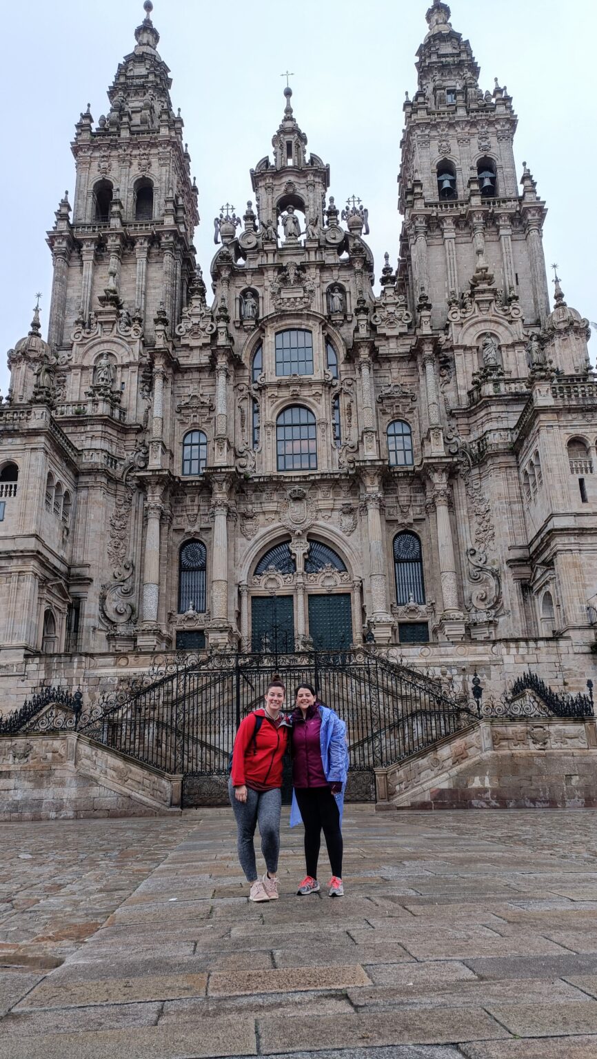 Two friends in front of the Cathedral of Santiago de Compostela
