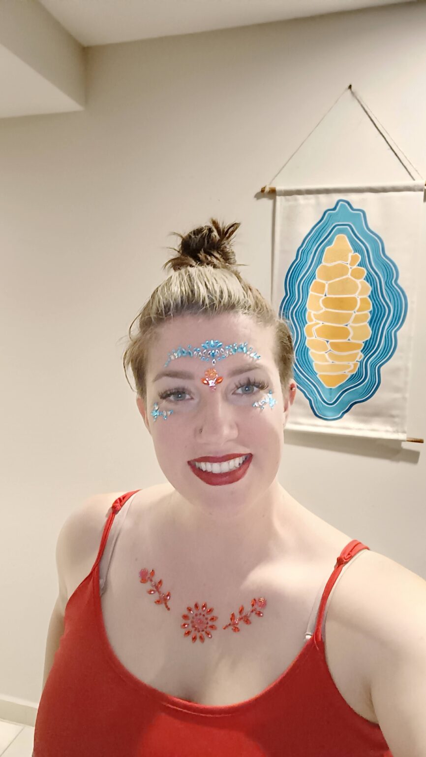 Hannah with festival face gems and body art before Tomorrowland Core
