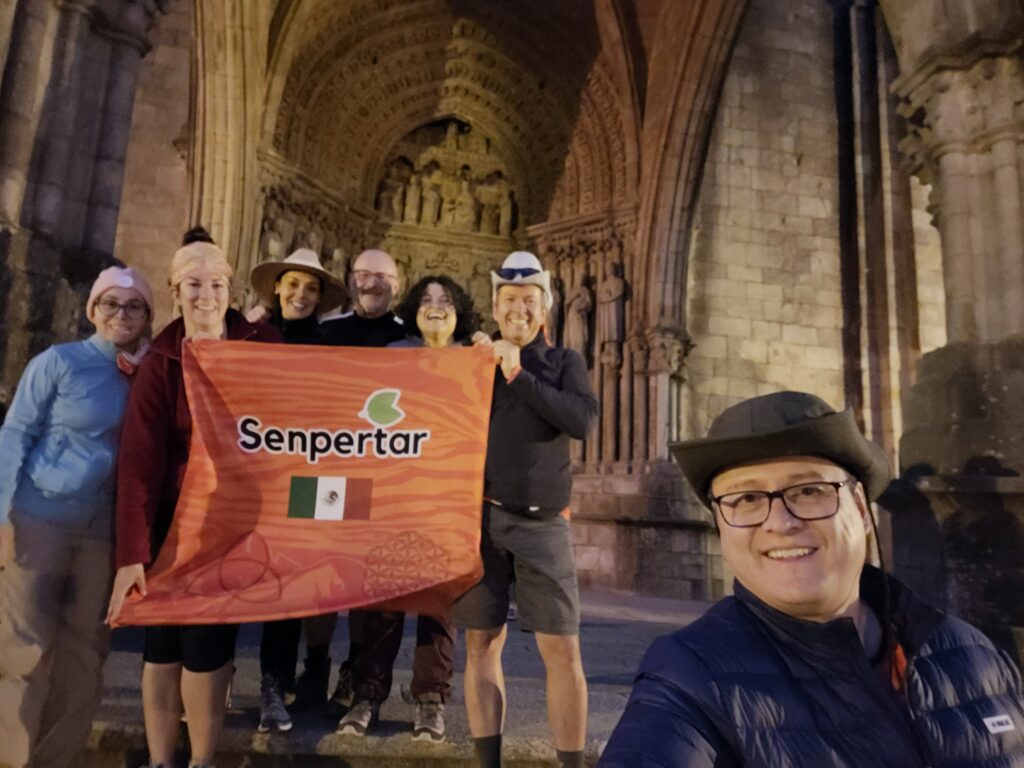 Hannah with friends holding a flag