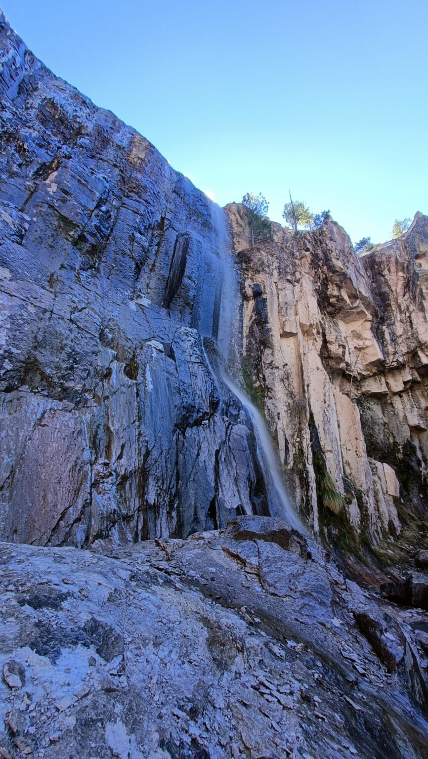 Waterfall pouring down a rock face in the Copper Canyon