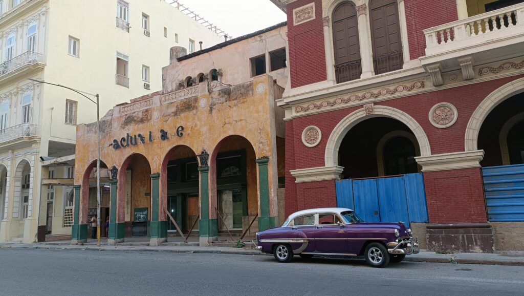 classic car parked on the street in cuba