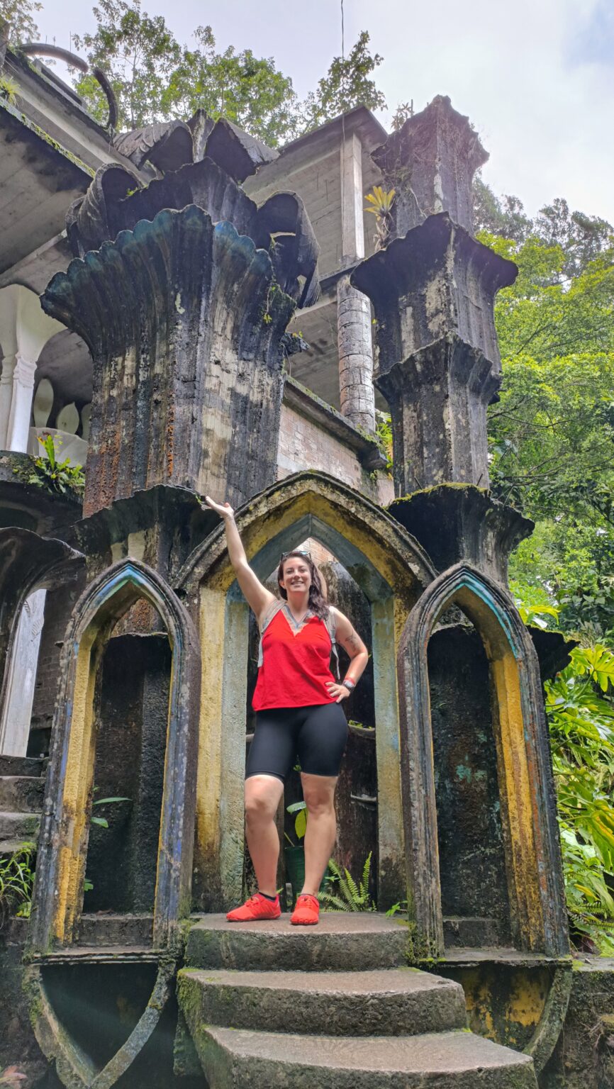 Hannah posing inside a Gothic concrete archway at Las Pozas