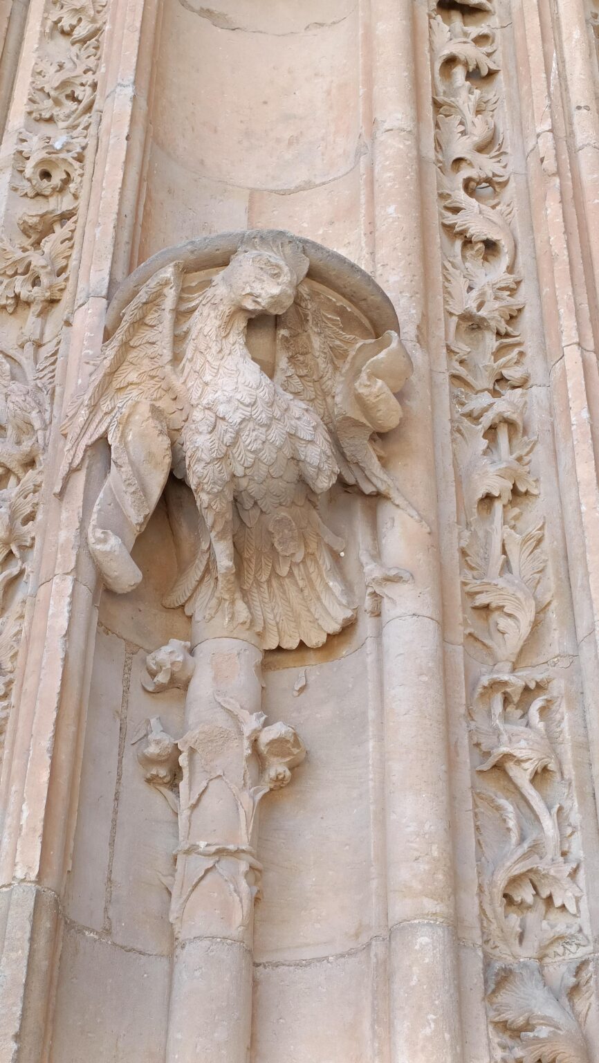 Carved stone bird on an ornate facade in Salamanca