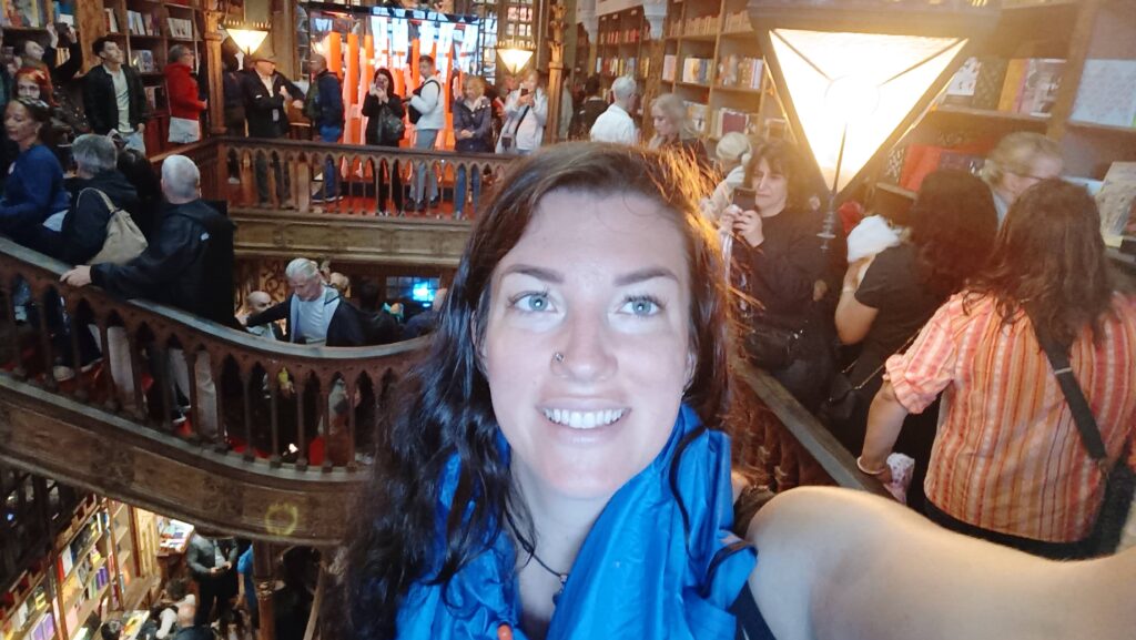 Hannah at Livraria Lello