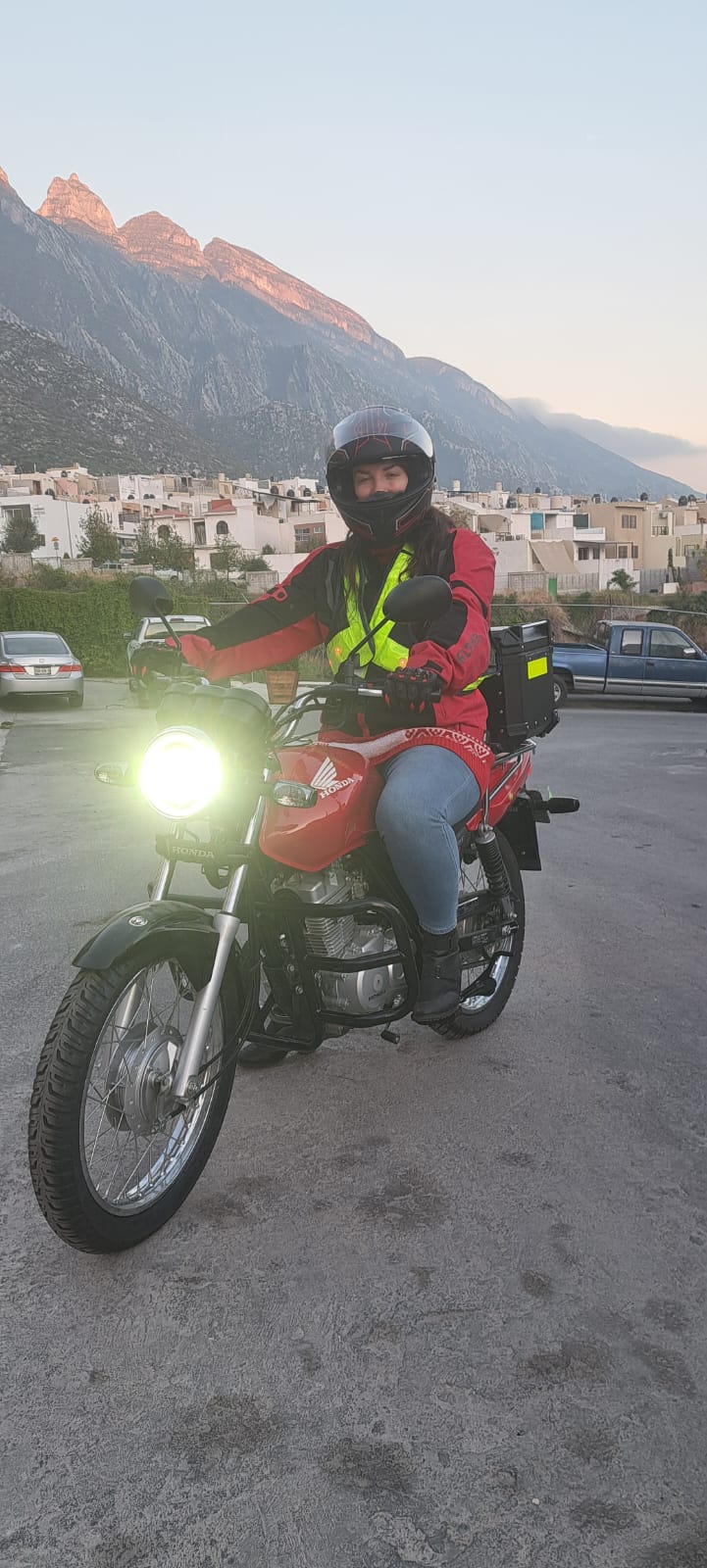 Rider on a red motorcycle on a road near Monterrey