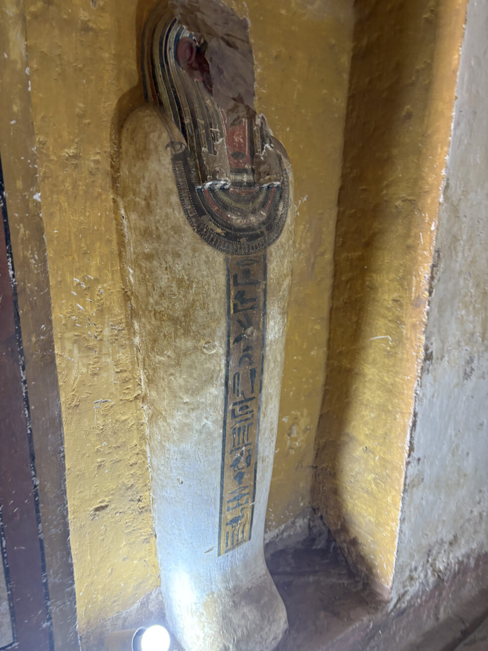 Painted ancient Egyptian relief inside a tomb in Aswan