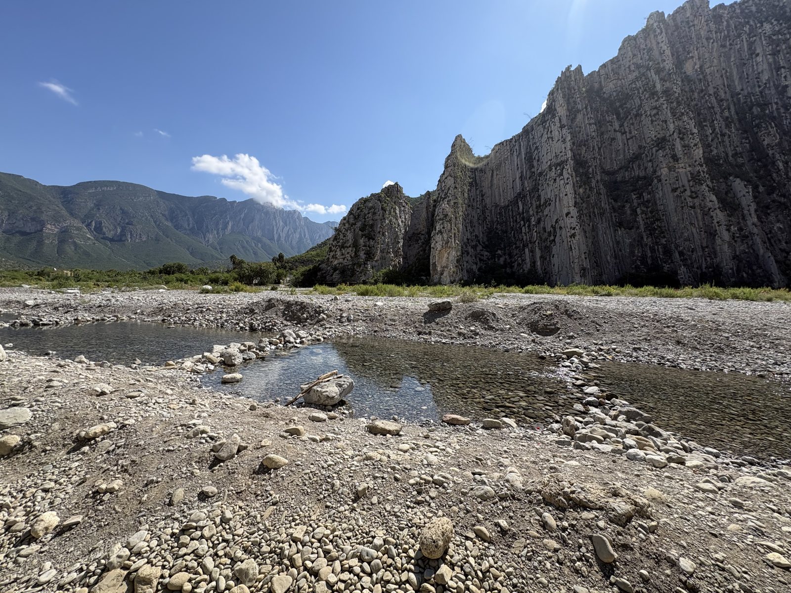A dry rocky riverbed with tall limestone walls in La Huasteca, Monterrey