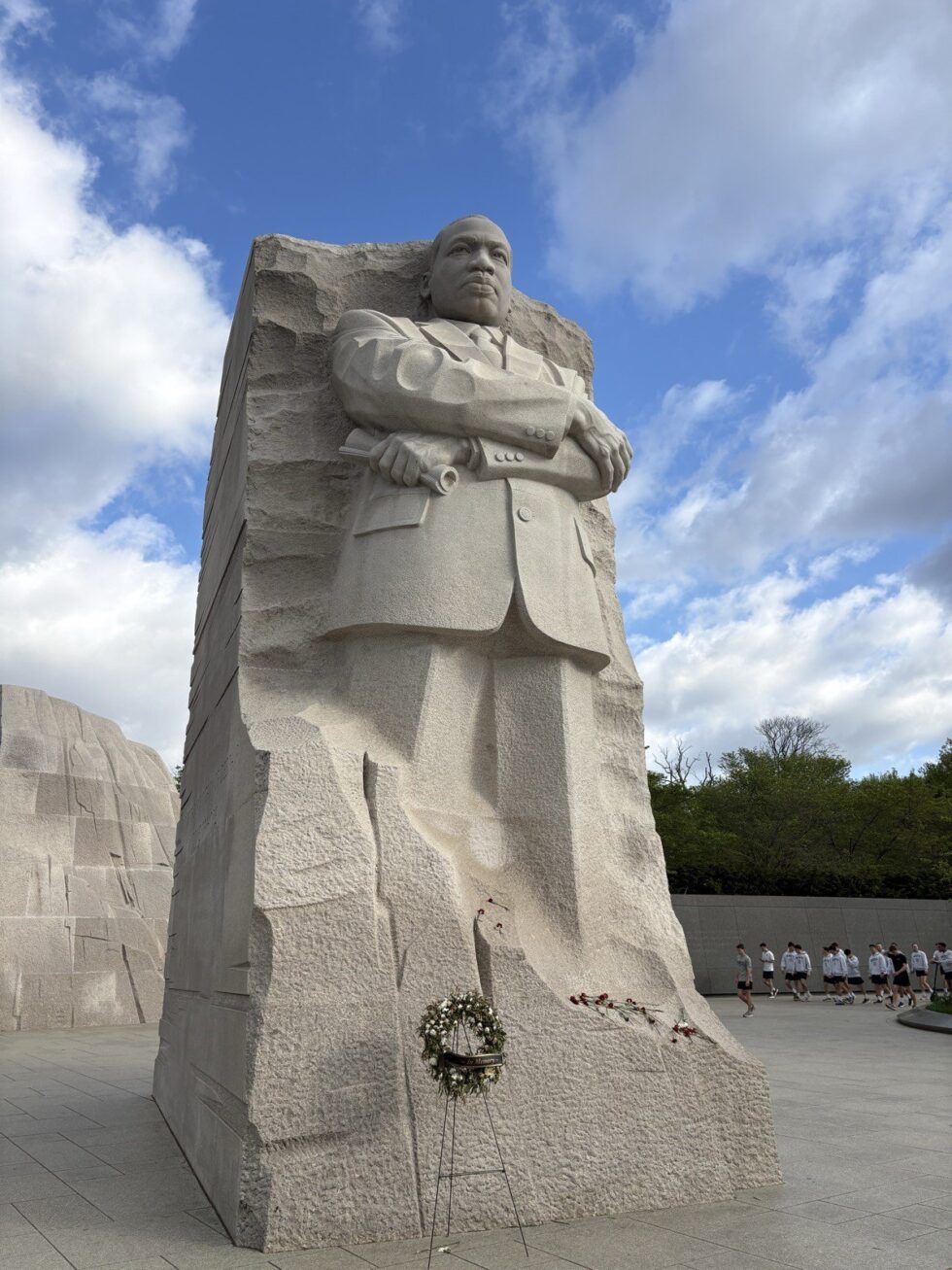 The Martin Luther King Jr. Memorial statue carved from white granite under a blue sky