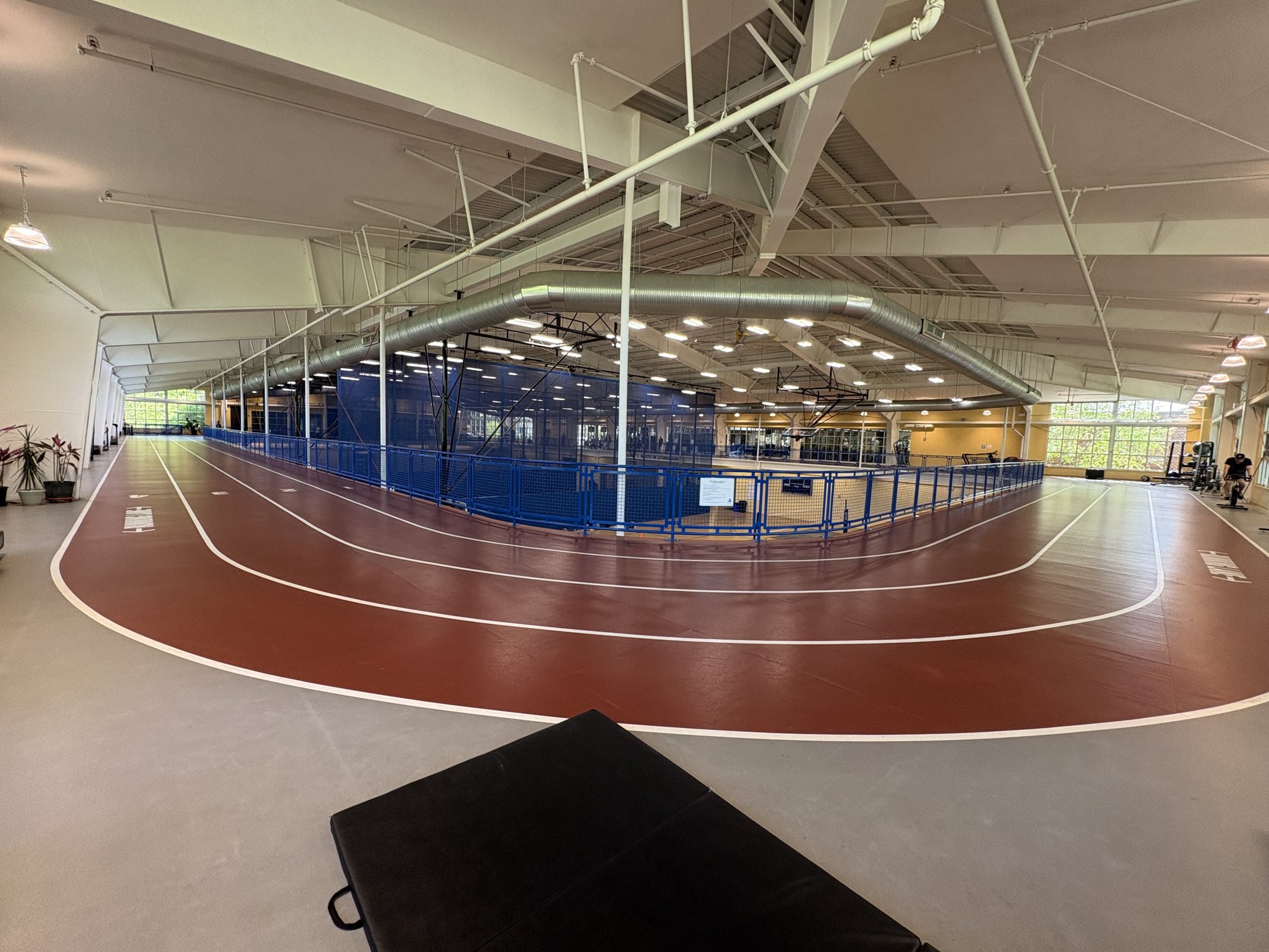 The empty indoor running track at the Pip Moyer Recreation Center, lanes marked in red.